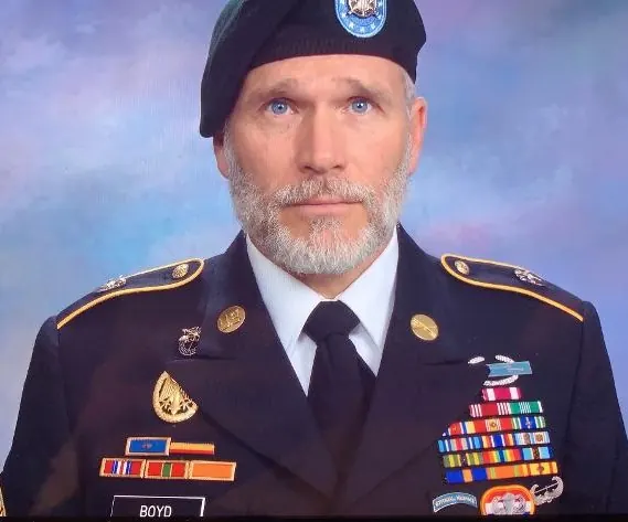 Portrait of Donald "Don" Boyd in U.S. Army dress uniform and beret, with a BOYD name tag and rows of ribbons.